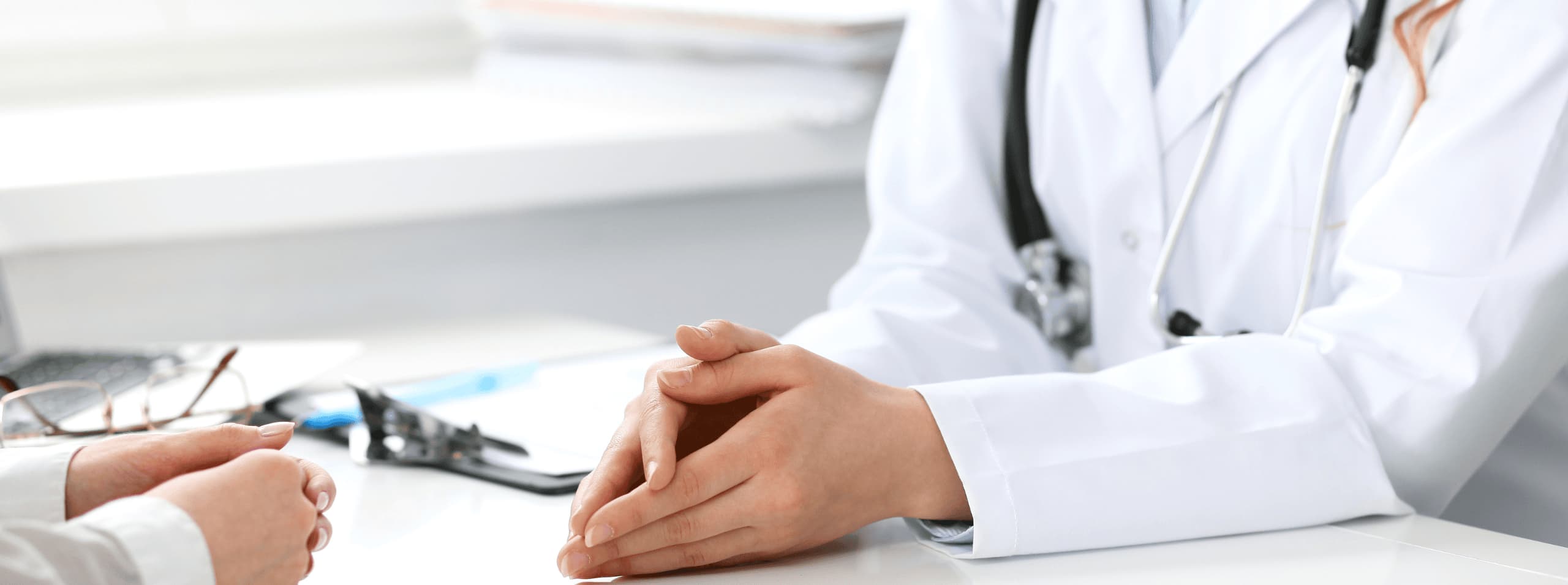 Primary care physician consulting with a patient